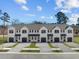 New townhome exterior featuring a driveway, garage, landscaping, and a modern white facade at 337 Bremerton Dr, Goose Creek, SC 29445