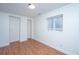 Finished basement area featuring wood floors, neutral walls, and a bright window at 338 King St # C, Charleston, SC 29401