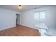 Bright kitchen features granite countertop, wood-look flooring, and an open doorway at 338 King St # C, Charleston, SC 29401