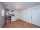 Bright kitchen features stainless steel appliances, granite countertop, and wood-look flooring at 338 King St # C, Charleston, SC 29401