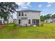 Backyard features an enclosed porch, mature landscaping and spacious lawn at 3802 Grateful Rd, North Charleston, SC 29420