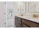 Bright bathroom with a double vanity, white countertop, and access to bedroom at 3802 Grateful Rd, North Charleston, SC 29420