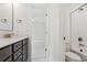 Bathroom featuring a single vanity with dark cabinets and an adjoining tub and shower at 3802 Grateful Rd, North Charleston, SC 29420