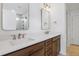 Bright bathroom featuring a double vanity with white countertop and framed mirrors at 3802 Grateful Rd, North Charleston, SC 29420