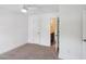 Neutral-toned bedroom featuring carpeted floors and an en-suite bathroom at 3802 Grateful Rd, North Charleston, SC 29420