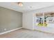 Cozy bedroom with neutral walls, plush carpeting, and a window view of the neighborhood at 3802 Grateful Rd, North Charleston, SC 29420