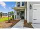 Inviting front entrance with elegant columns and detailed sidelights, creating a warm and welcoming appeal at 3802 Grateful Rd, North Charleston, SC 29420