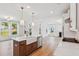 Bright kitchen featuring white cabinetry, stainless steel appliances and a center island overlooking the living area at 3802 Grateful Rd, North Charleston, SC 29420