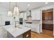 Modern kitchen featuring white cabinetry, a center island, and stainless steel appliances overlooking the fireplace at 3802 Grateful Rd, North Charleston, SC 29420