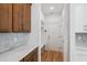 Mud room with beautiful cabinets, quartz countertops, subway tile backsplash, and convenient built-in bench at 3802 Grateful Rd, North Charleston, SC 29420
