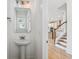 Powder room featuring white walls, a pedestal sink, and a mirror at 3802 Grateful Rd, North Charleston, SC 29420