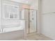 Stylish bathroom featuring a separate tub, shower, and sleek fixtures, for a modern experience at 3806 Grateful Rd, North Charleston, SC 29420
