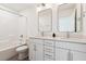 Bright bathroom featuring a double vanity with white cabinets and a shower-tub combo at 3806 Grateful Rd, North Charleston, SC 29420
