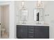 Contemporary bathroom with double vanity, stylish light fixtures, and sleek gray cabinetry at 3806 Grateful Rd, North Charleston, SC 29420