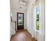 Bright entryway featuring hardwood floors, a view of the outdoors, and lots of natural light at 3806 Grateful Rd, North Charleston, SC 29420