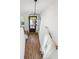 Foyer with hardwood floors, a modern chandelier and staircase leads to other floors at 3806 Grateful Rd, North Charleston, SC 29420