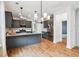 Open kitchen with an island, stainless steel appliances, and lots of bright light at 3806 Grateful Rd, North Charleston, SC 29420