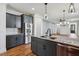 Modern kitchen featuring an island with marble counters, stainless steel appliances, and an open layout at 3806 Grateful Rd, North Charleston, SC 29420