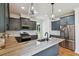 Modern kitchen featuring stainless steel appliances, marble countertops, and pendant lighting at 3806 Grateful Rd, North Charleston, SC 29420