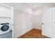 Well-lit laundry room featuring modern appliances and an open doorway to another room at 3806 Grateful Rd, North Charleston, SC 29420