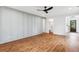 Modern living room with a hardwood floor, shiplap accent wall, and access to the hallway at 3806 Grateful Rd, North Charleston, SC 29420