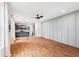 Open-concept living room boasts hardwood floors, and a modern kitchen with gray cabinets at 3806 Grateful Rd, North Charleston, SC 29420