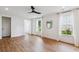 Hardwood floors and white walls create a serene space in this well-lit living room at 3806 Grateful Rd, North Charleston, SC 29420