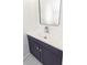 Stylish half bathroom with a dark vanity, chrome faucet, and elegant fixtures at 405 Simmons Ave, Summerville, SC 29483