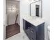 Bathroom boasts a modern vanity with stone countertops and decorative mirror at 405 Simmons Ave, Summerville, SC 29483