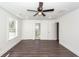 Bright bedroom with hardwood floors, ceiling fan, and ensuite bathroom access at 405 Simmons Ave, Summerville, SC 29483