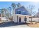 Charming two-story home with a welcoming front porch and beautiful blue and white accents at 405 Simmons Ave, Summerville, SC 29483