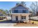 Inviting two-story home boasting a covered front porch and freshly landscaped yard at 405 Simmons Ave, Summerville, SC 29483