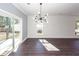 Bright living room featuring hardwood floors, modern lighting, and sliding glass doors to the outside at 405 Simmons Ave, Summerville, SC 29483