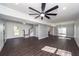 Open living area featuring dark wood floors, recessed lighting, and access to backyard at 405 Simmons Ave, Summerville, SC 29483