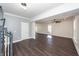 Spacious living room with hardwood floors, crown molding and stairs to second floor at 405 Simmons Ave, Summerville, SC 29483
