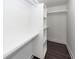 Walk-in closet featuring built in shelves and luxury vinyl plank flooring at 405 Simmons Ave, Summerville, SC 29483