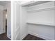 Walk-in closet with built in shelves and luxury vinyl plank flooring at 405 Simmons Ave, Summerville, SC 29483