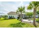 Spacious backyard with lush landscaping, mature trees, and a patio area at 415 True North Trail, Summerville, SC 29486