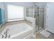Relax in this bathroom's soaking tub or enjoy the separate tiled shower at 415 True North Trail, Summerville, SC 29486