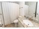 This well-lit bathroom features a granite countertop, sleek faucet, and a shower with curtain at 415 True North Trail, Summerville, SC 29486