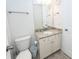 Well-lit bathroom features a vanity with granite countertop, modern faucet, and decorative mirror at 415 True North Trail, Summerville, SC 29486