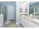 Well-lit bathroom features granite countertops, double sinks, and a tiled shower at 415 True North Trail, Summerville, SC 29486