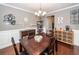 Dining room featuring hardwood floors, decorative lighting, and neutral wall color at 415 True North Trail, Summerville, SC 29486