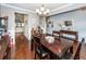 Dining room with hardwood floors, decorative lighting, and neutral wall color at 415 True North Trail, Summerville, SC 29486