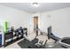 Spacious workout room including rowing machine, free weights, and exercise equipment near an open doorway at 415 True North Trail, Summerville, SC 29486