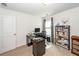 Functional home office with a neat desk, comfortable chair, shelving unit, and natural light from the window at 415 True North Trail, Summerville, SC 29486