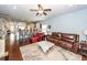 Cozy living room with hardwood floors, a ceiling fan, and an open design at 415 True North Trail, Summerville, SC 29486