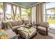 Relaxing screened-in porch with wicker furniture and natural light at 415 True North Trail, Summerville, SC 29486