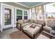 Cozy screened-in porch with comfortable seating and an outdoor view at 415 True North Trail, Summerville, SC 29486