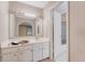 Modest bathroom with a large mirror, white vanity, and a separate room for the shower offers basic functionality at 4606 Moss Ct, North Charleston, SC 29420